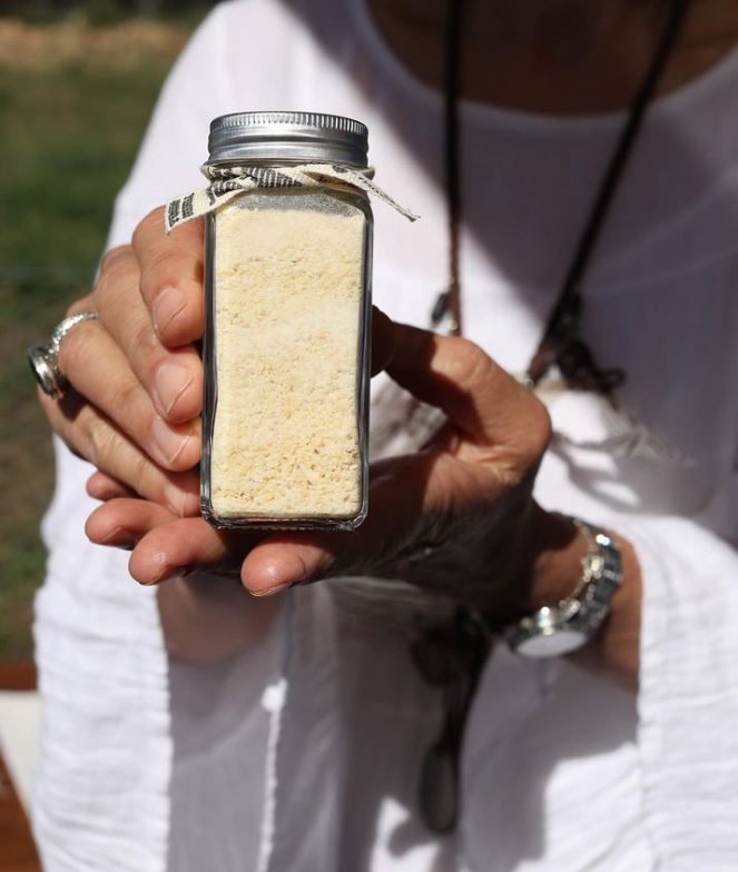 Woman holding garlic salt